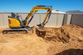 Mini excavator digging